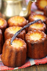 Image showing  Small French cakes Canele and vanilla.