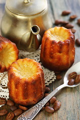 Image showing Cake canneles and old coffee pot.