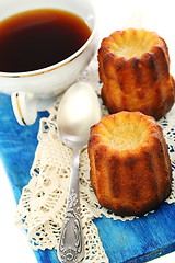 Image showing French small cake and cup of tea.