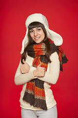 Image showing Winter girl showing thumbs up