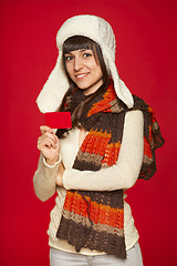 Image showing Winter woman holding credit card