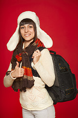 Image showing Winter woman tourist with backpack