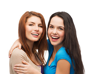 Image showing two laughing girls hugging