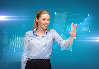 Image showing woman working with imaginary virtual screen
