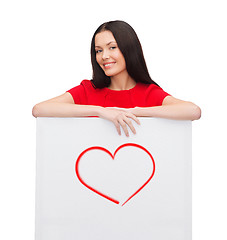 Image showing young woman with white board and heart on it