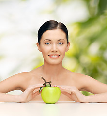 Image showing beautiful woman with green apple