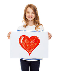 Image showing smiling little child holding picture of family