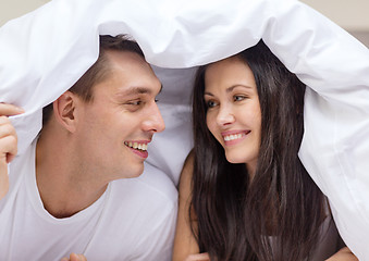 Image showing happy couple sleeping in bed