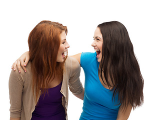 Image showing two laughing girls looking at each other