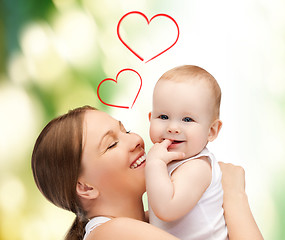 Image showing happy mother with adorable baby