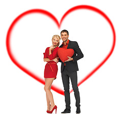 Image showing beautiful couple holding big heart