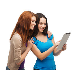 Image showing two smiling teenagers with tablet pc computer