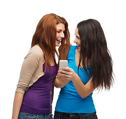 Image showing two smiling teenagers with smartphone