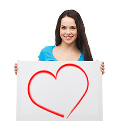 Image showing smiling young girl with blank white board