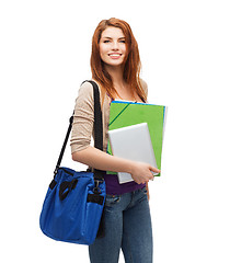 Image showing smiling student with bag, folders and tablet pc