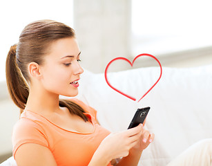 Image showing woman with smartphone at home