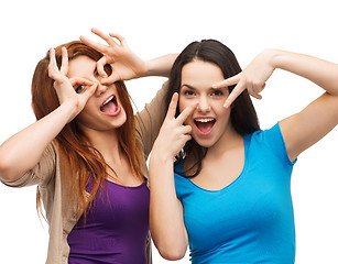 Image showing two young teenagers making faces
