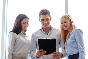 Image showing business team looking at clipboard