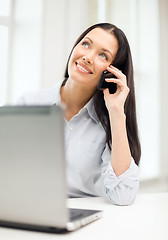 Image showing smiling businesswoman or student with smartphone