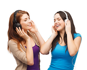 Image showing two smiling teenagers with headphones