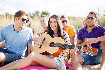 Image showing group of friends having fun on the beach