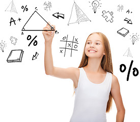 Image showing smiling girl in blank white shirt drawing triangle