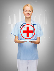 Image showing smiling female doctor or nurse with tablet pc