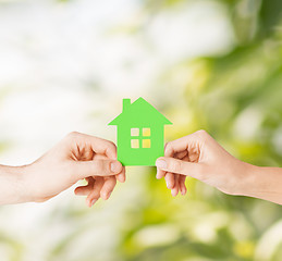 Image showing couple hands holding green house