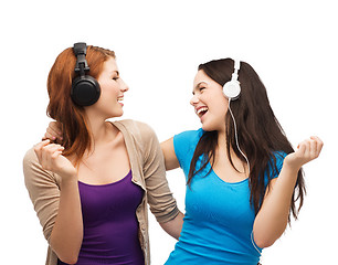 Image showing two laughing girls with headphones