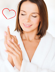 Image showing beautiful woman in bathrobe