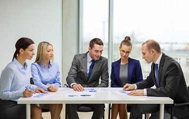 Image showing business team with documents having discussion