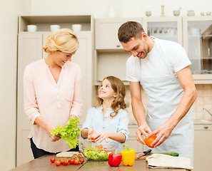 Image showing happy family making dinner in kitchen