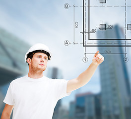 Image showing male architect pointing at blueprint