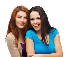 Image showing two laughing girls hugging