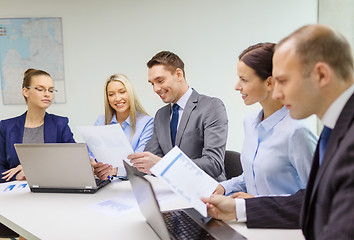 Image showing business team with laptop having discussion