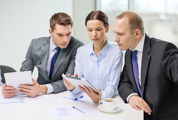 Image showing business team with tablet pc having discussion