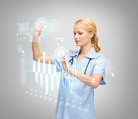 Image showing doctor or nurse working with virtual screen