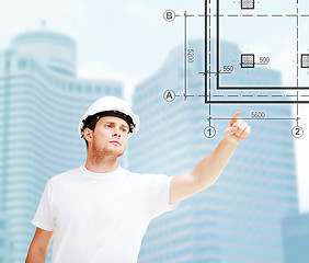 Image showing male architect pointing at blueprint