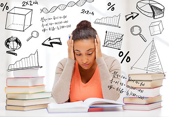 Image showing tired student with books and notes