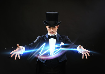 Image showing magician in top hat showing trick