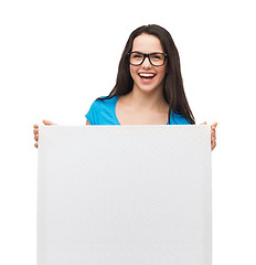 Image showing smiling girl with eyeglasses and white blank board
