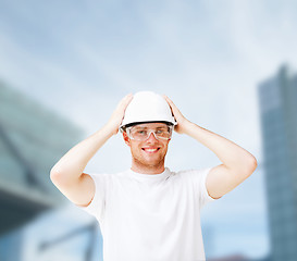 Image showing male architect in helmet with safety glasses