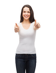 Image showing teenager in white t-shirt showing thumbs up