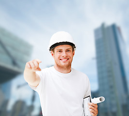 Image showing male architect in helmet pointing at you