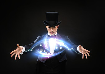 Image showing magician in top hat showing trick