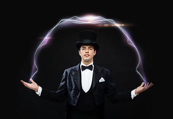 Image showing magician in top hat showing trick