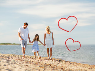 Image showing happy family walking at the seaside