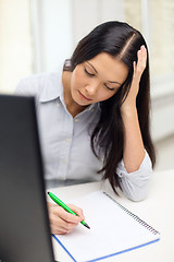 Image showing tired businesswoman or student