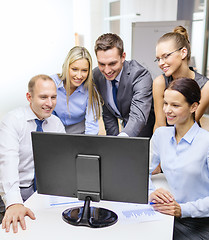 Image showing business team with monitor having discussion