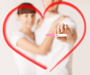 Image showing woman and man hands with pregnancy test